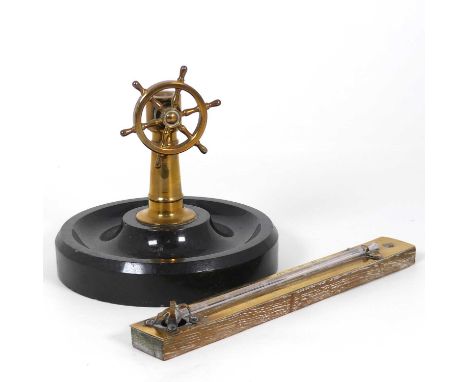 A novelty ashtray surmounted by a cigar cutter ion the form of a ship's wheel, height 13cm, together with an early 20th centu