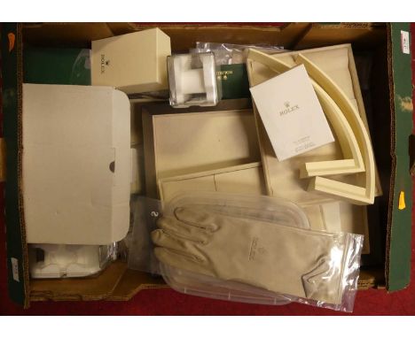 A collection of Rolex retailer's items to include trays, display stands and gloves, together with various accessories and pro