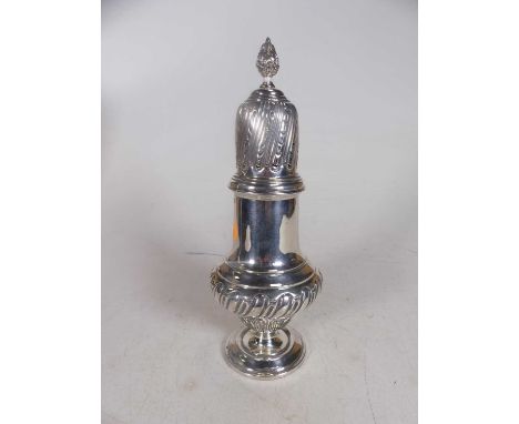 A late Victorian silver pedestal lighthouse sugar sifter, the domed cover with flaming torch finial, the body of half gadroon