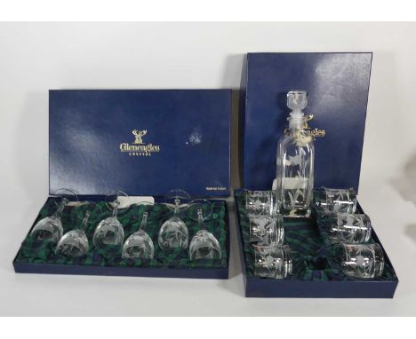 A Gleneagles crystal decanter having etched thistle decoration, height 30cm, with a set of six matching tumblers, boxed, toge