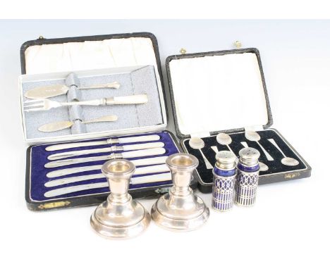 A pair of Elizabeth II silver dwarf table candlesticks on weighted bases, makers Sanders &amp; Mackenzie (Ernest Wilfred Sand