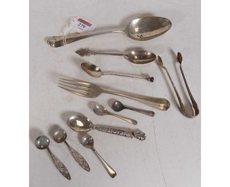 An 18th century silver serving spoon together with various other loose flat wares to include table fork, sugar tongs, tea spo