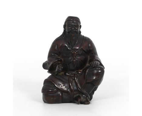A Japanese bronze figure of a gentleman, modelled seated, unsigned, height 10.5cmSword missing to right hand.Scabbard missing
