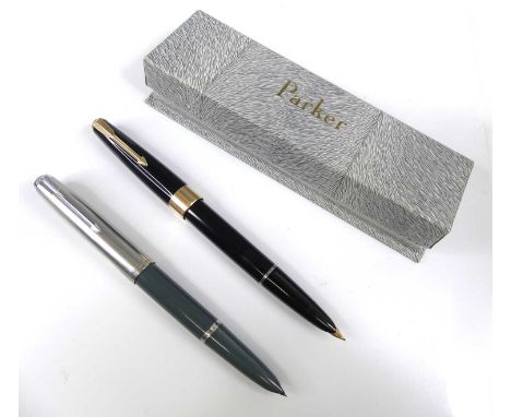 Two vintage Parker 51 fountain pens, one in black with gold trim and double-jewelled ends, in card Parker box with original r