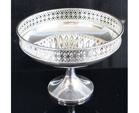 A George V silver pedestal comport, having a circular pierced rim on a domed foot, maker Walker &amp; Hall, Sheffield, 1919, 