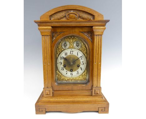 A late 19th century German walnut cased bracket clock by Junghams, having unsigned brass dial with Arabic chapter ring, subsi