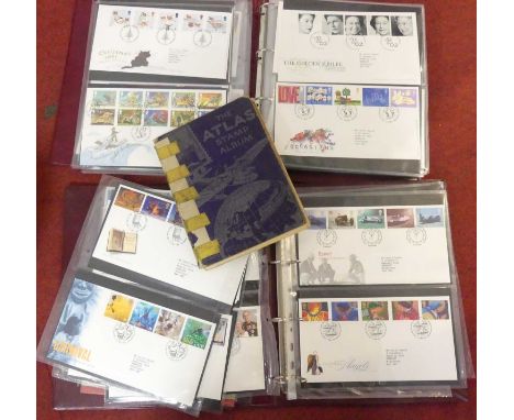 An Atlas Schoolboy stamp album, part filled, together with a collection of Royal Mail first day covers 