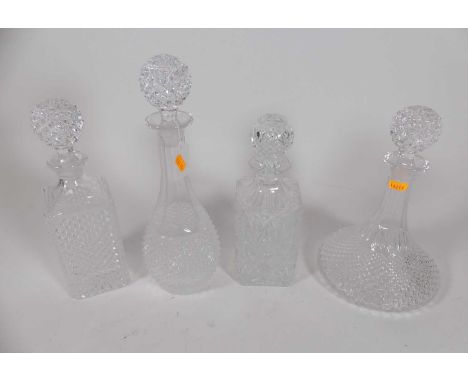 A group of four glass decanters to include ships decanter, height 27cm