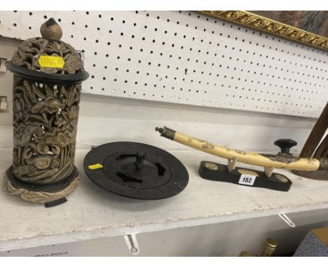 An Opium pipe, incense burner etc.