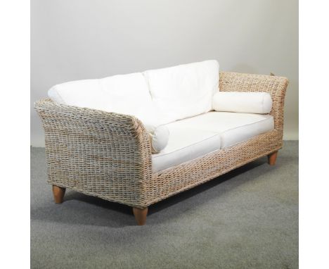A woven three seater sofa, with loose cushions, 205cm