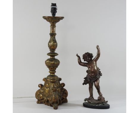A bronzed model of a cherub, together with a gilt lamp base, 51cm high