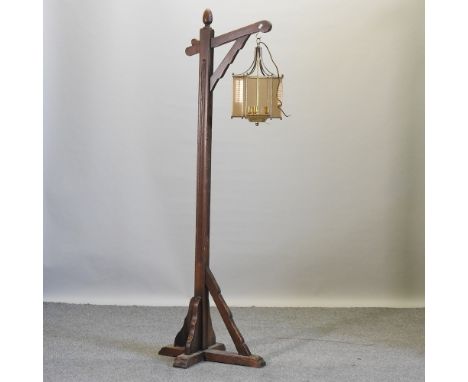 A wooden lantern stand, 178cm high, together with a brass and glass lantern
