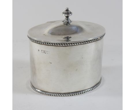 An Edwardian silver tea caddy, of oval shape, with a hinged lid, London 1907, 12cm high