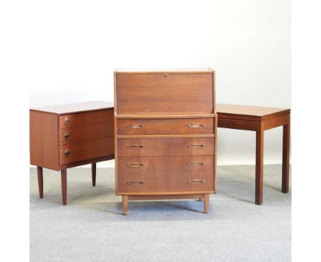 A 1970's teak bureau, 76cm, together with a folding card table and a chest of drawers (3)