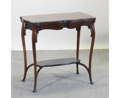 An Edwardian mahogany folding card table, on cabriole legs, 77cm