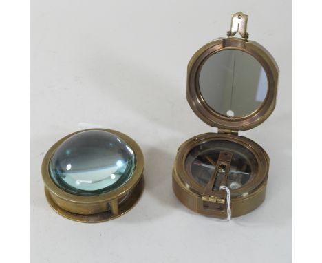 A reproduction brass brunton compass, together with a navigating compass and magnifier