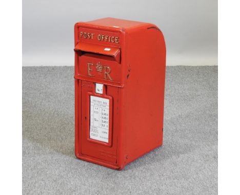 A reproduction red painted post box, 60cm high