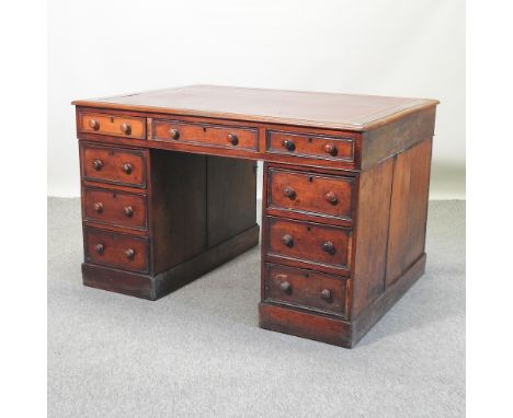 A Victorian mahogany partners desk, with a red leather inset top, 120cm