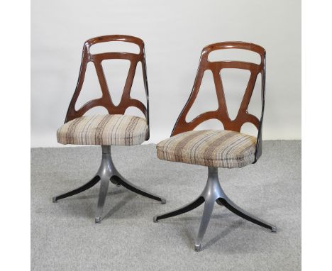 A pair of 1960's lucite and chrome swivel desk chairs