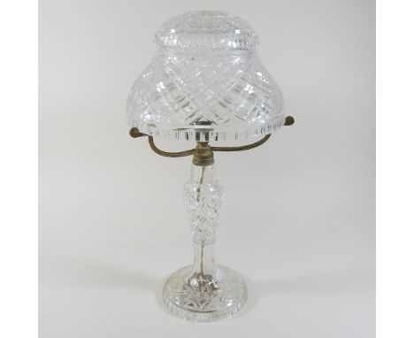 An early 20th century cut glass table lamp, with a glass shade, 47cm high