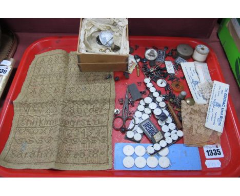 A XIX Century Sampler by Sarah Pick, zodiac linen buttons, needles etc:- One Tray