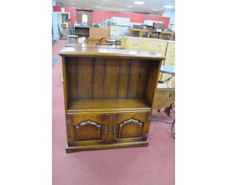 The Royal Oak Furniture Company Oak Bookcase, having single shelf over cupboard doors, 91cm wide.