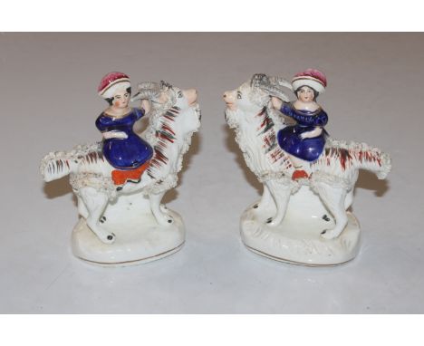 A pair of 19th Century Staffordshire figures depicting Princess Adderley seated on goat AF