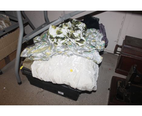 A box of various material and curtains 