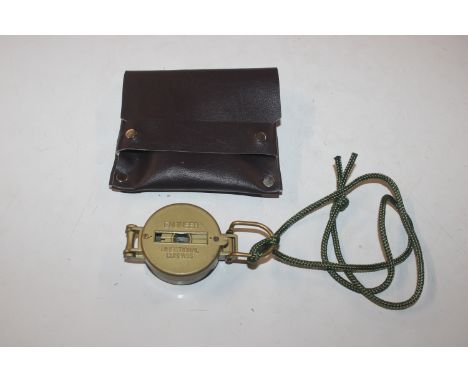 An engineer directional compass and pouch