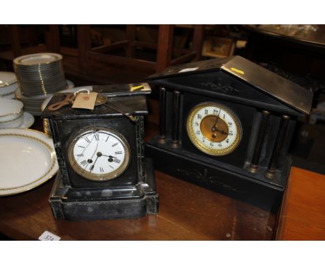 A Victorian black marble mantel clock with eight day movement AF; and another