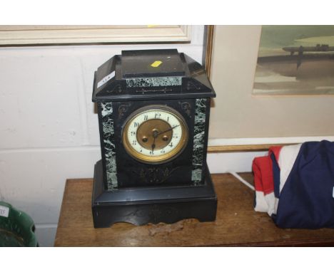 A Victorian slate mantel clock with eight day movement 