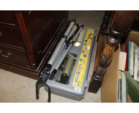 An Astrolon telescope with tripod in carry case