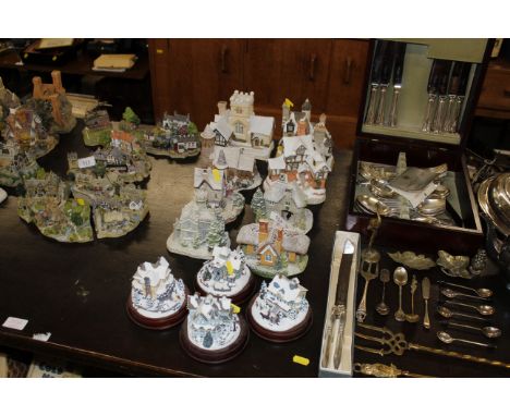 A quantity of Thomas Kinkades Celebration of Light collection model cottages, Lilliput Lane model cottages, and David Winter 
