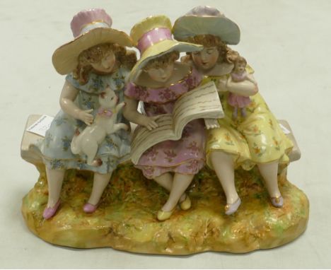 A large ceramic Continental style figure group: of girls seating on bench reading. Height 23cm 