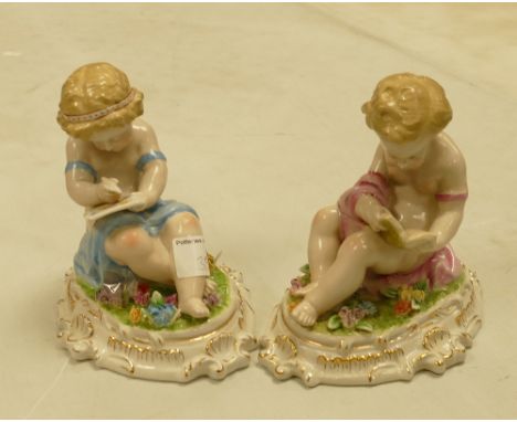 A pair of Continental style ceramic figures: of children reading (2) 