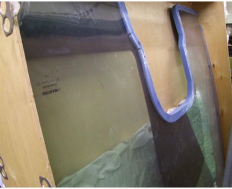 A Manitou windscreen for a tractor/digger. 