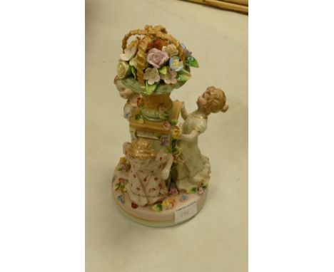 20th century ceramic Continental style figures: of larger girls around floral garden ornament 