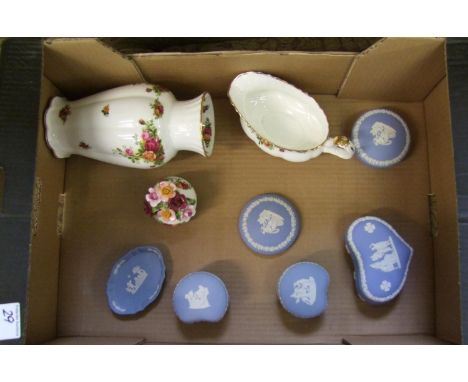 A mixed collection of ceramic items: including Wedgwood jasper ware lidded trinket boxes, Royal Albert Old Country Roses vase