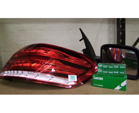 A car wing mirror, Mercedes rear light and Lucas bulbs. 