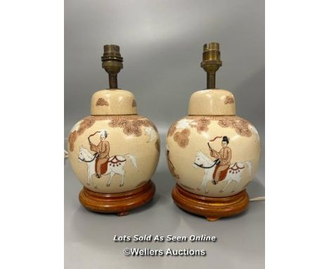 A pair of Japanese ginger jars converted to lamps, decorated with figures. both 25cm high including base and light fitting. B