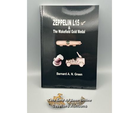 Two brass first world war Territorial Army shoulder badges as featured in the book Zeppelin L15 &amp; The Wakefield Gold Meda