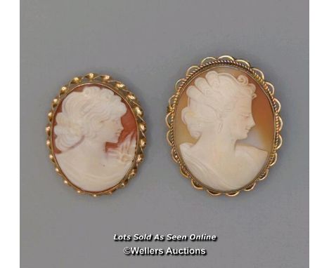 Two modern oval shell cameo brooches, the first mounted in 9ct gold with twisted wire border and roller safety catch fitting,