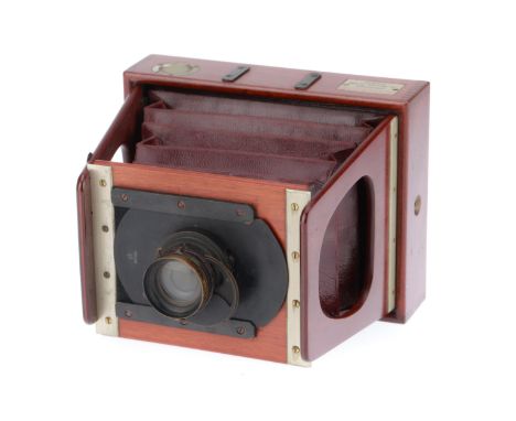 A Darlot Gate Strut Folding Camera, wood and metal construction, serial number 700, quarter plate, opens and closes properly,