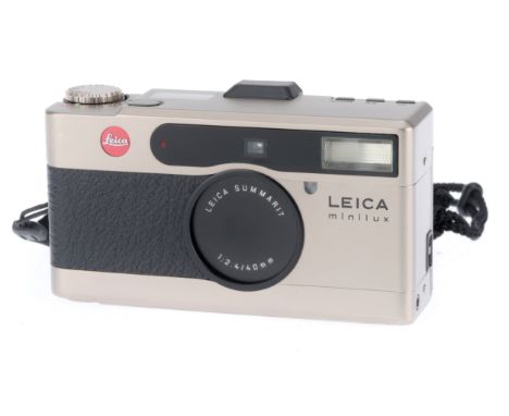 A Leica Minilux Compact Camera, grey finish, serial number 2071836, body F-G, some usage marks, owner's sticker on base which