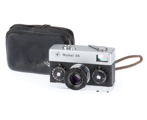 A Rollei 35 Compact Camera, silver, body G, shutter works, advance works, with soft case.