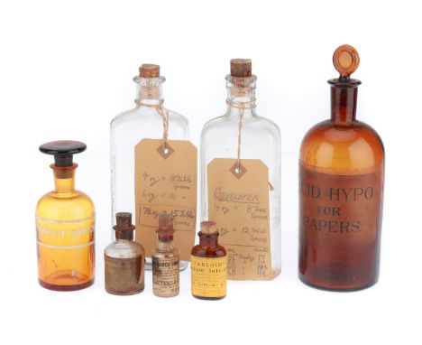 A Collection of Photography Lab Bottles, 7off bottles various sizes, with stoppers.BUYER BEWARE: WE CANNOT SHIP THIS ITEM. CO