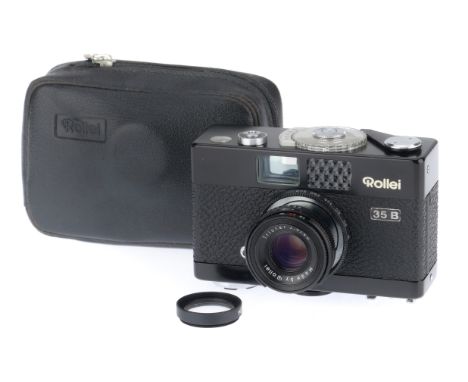 A Rollei 35B Compact Camera, black, body G, shutter works, advance mechanism works but feels notchy, light meter responds, wi