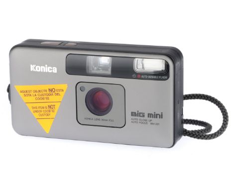 A Konica Big Mini Compact Camera, greay, body F, has stickers attached but good otherwise, powers up, lens extends, takes a p