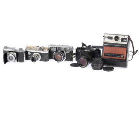 A Group of 35mm Cameras, to include a Mamiya ZE, body G, shutter works, with a f/3.5 28mm lens and a f/3.5 135mm lens, a Fuji