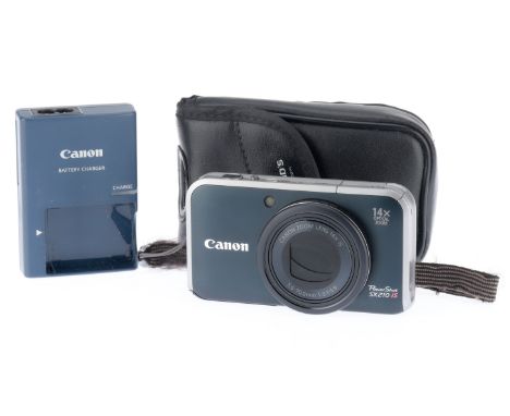 A Canon Powershot SX210 IS Compact Digicam, black, body VG, powers up, takes a picture, flash works, with charger, battery an